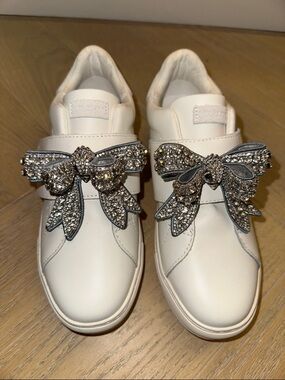 Kurt Geiger White Slip-On Sneakers with Crystal Bow Embellishments